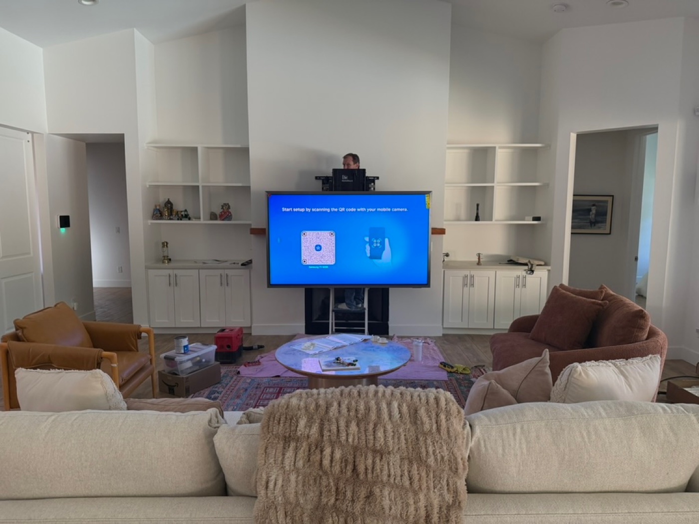 The TV is shown in the pulled-down viewing position.