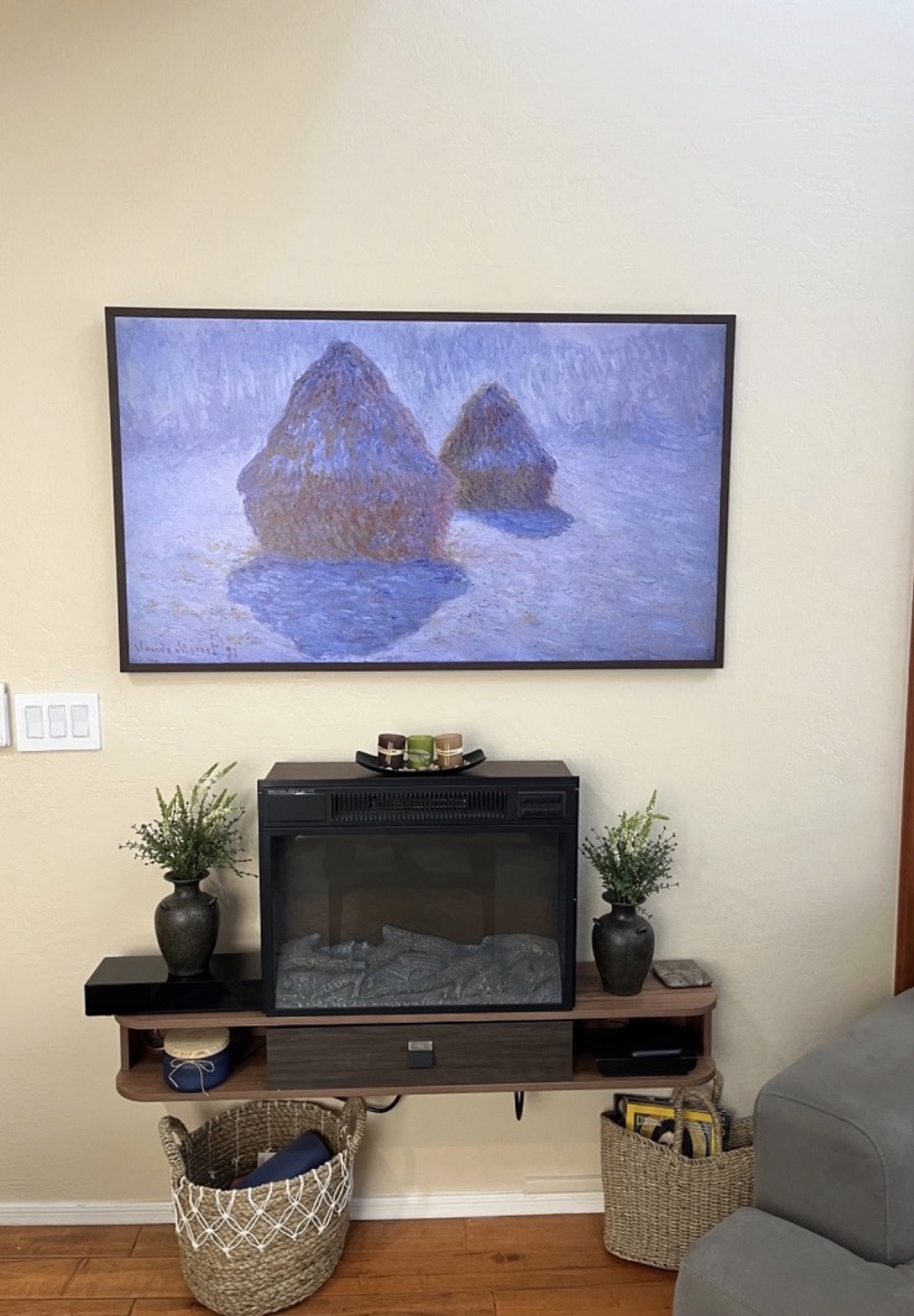 Frame TV above fireplace