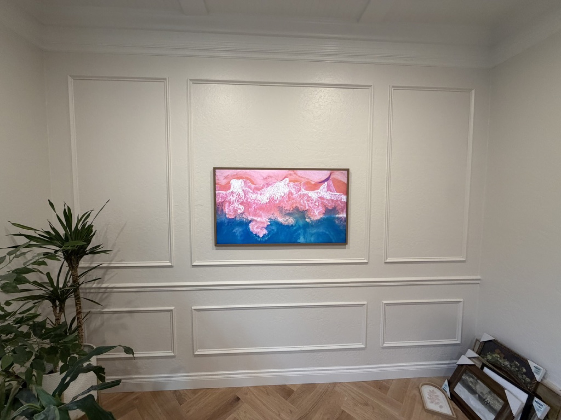 Frame TV on paneled wall