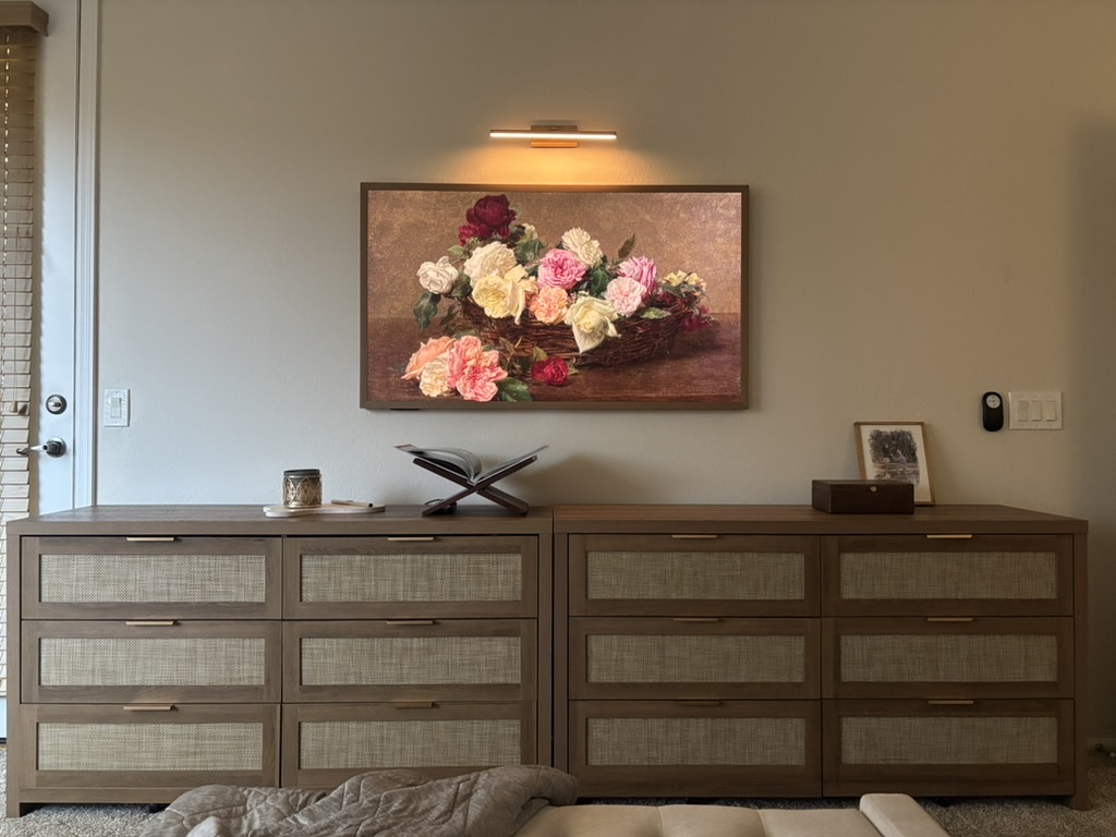 Hisense Canvas TV displaying floral artwork above a console