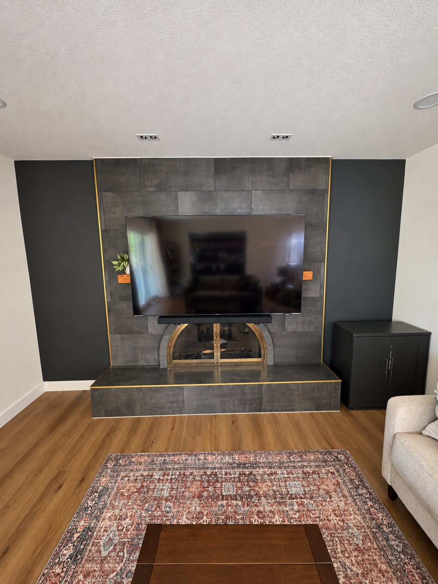 TV lowered into viewing position with the mantel visible
