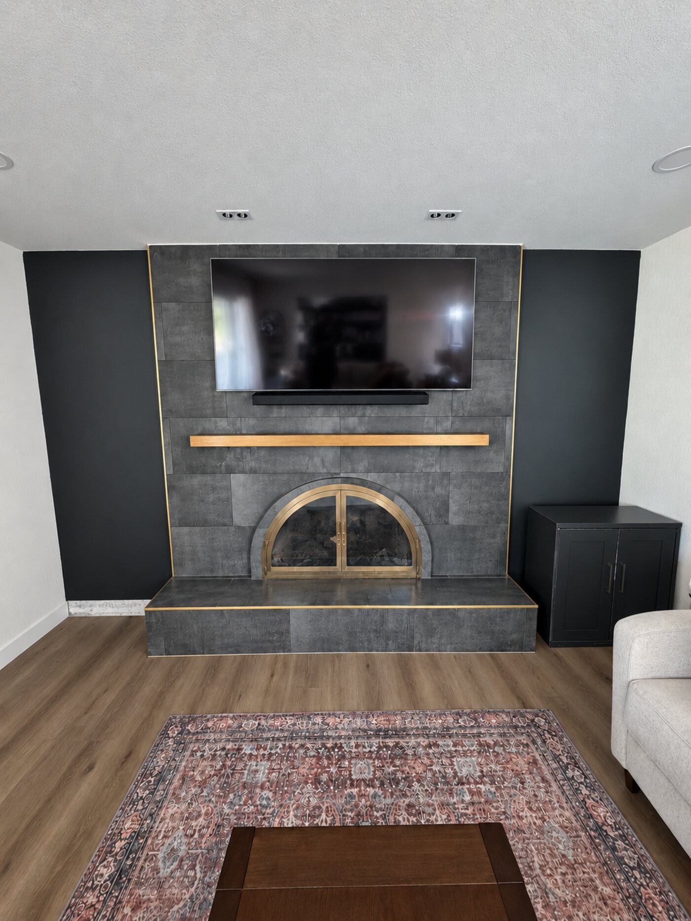 TV raised above the mantel on a MantelMount